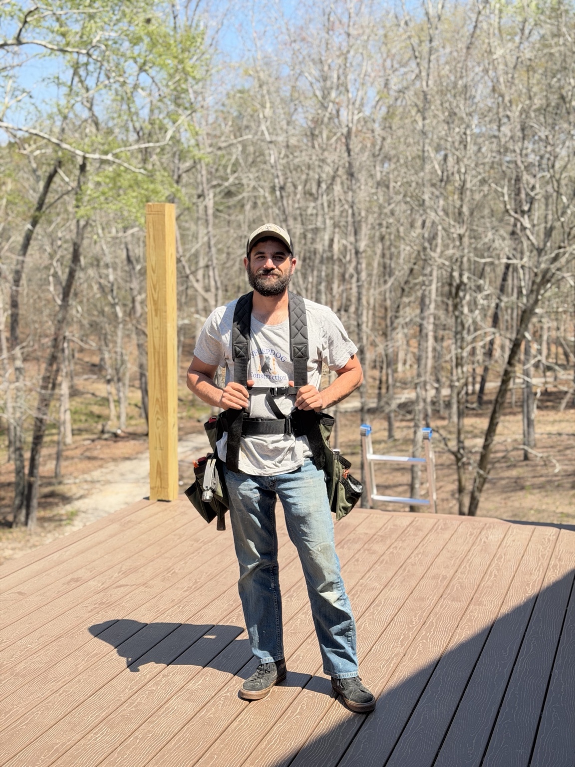 Chase Renninger wearing his tool rig on a deck project